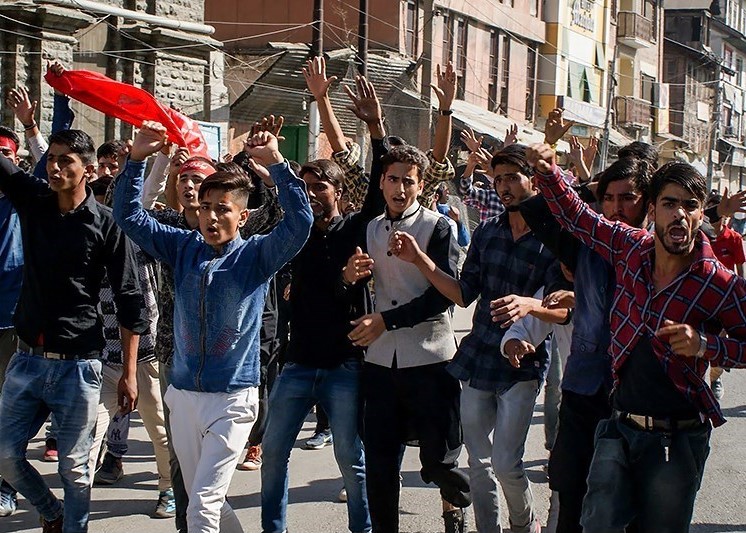 Protest in Pakistan-controlled Kashmir over rising prices leaves police officer dead and over 90 people injured