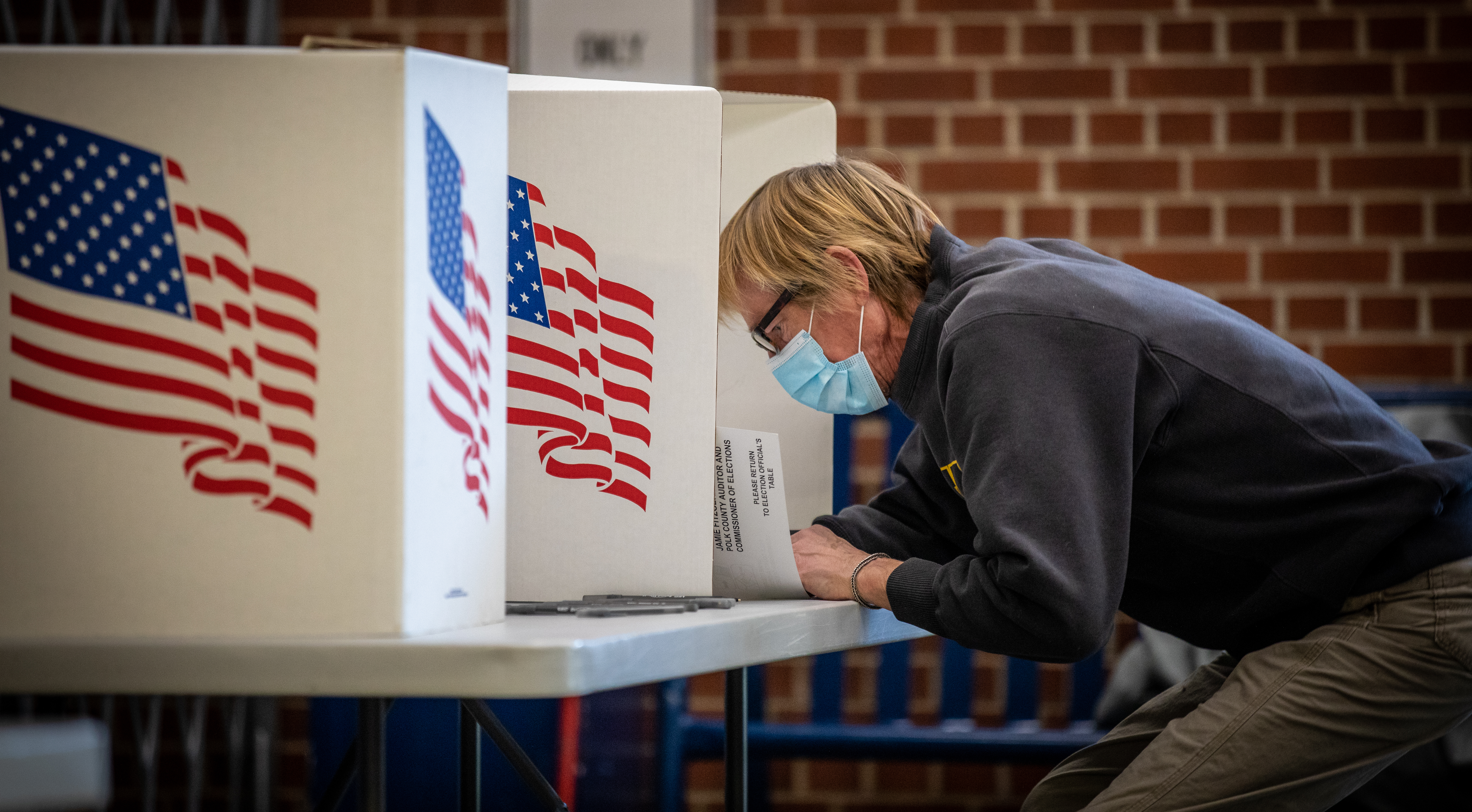 DOJ sues Georgia over new law restricting voting