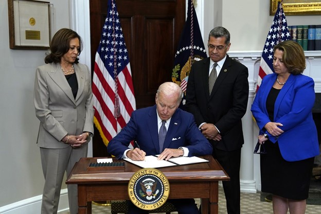 Biden signs omnibus spending bill containing progressive measures for pregnant workers